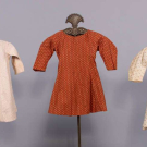 THREE PRINTED COTTON CHILDRENS DRESSES, 1850s