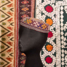 EMBROIDERED MANS CAP &amp; TWO EMBROIDERED OR IKAT TEXTILES, EARLY-MID 20TH C