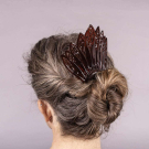FOUR CELLULOID HAIR COMBS, 1880S - 1930S