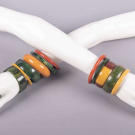 COLLECTION OF BAKELITE OR COMPOSITE BANGLES, 1930-MID 20TH C