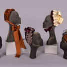 FIVE EMBELLISHED VELVET BONNETS, NEW YORK, 1880s