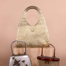 THREE LUCITE OR LEATHER METALLIC HANDBAGS, 1950S