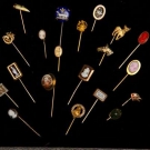 TWENTY FIVE PORTRAIT OR ANIMAL STICK PINS, 1890-1930