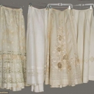 FOUR LINEN &amp; LACE WHITE SKIRTS, 1900-1910
