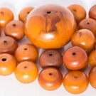 TWENTY FOUR EGG YOLK AMBER BEADS