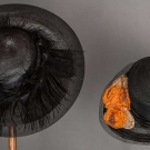 TWO BLACK STRAW HATS, 1920s