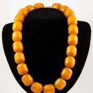 TWENTY TWO AMBER BEADS, EARLY 20TH C