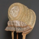 YELLOW SILK DRAWN BONNET, 1850s