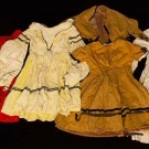 4 GIRL'S DRESSES, MID 19TH C