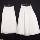 2 WHITE COTTON QUILTED PETTICOATS, MID 19TH C