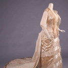 CREAM SILK TRAINED EVENING/PRESENTATION GOWN, 1880s