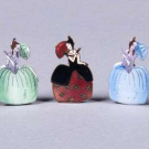 SEVEN ENAMELED PLACE CARD HOLDERS, 1920s